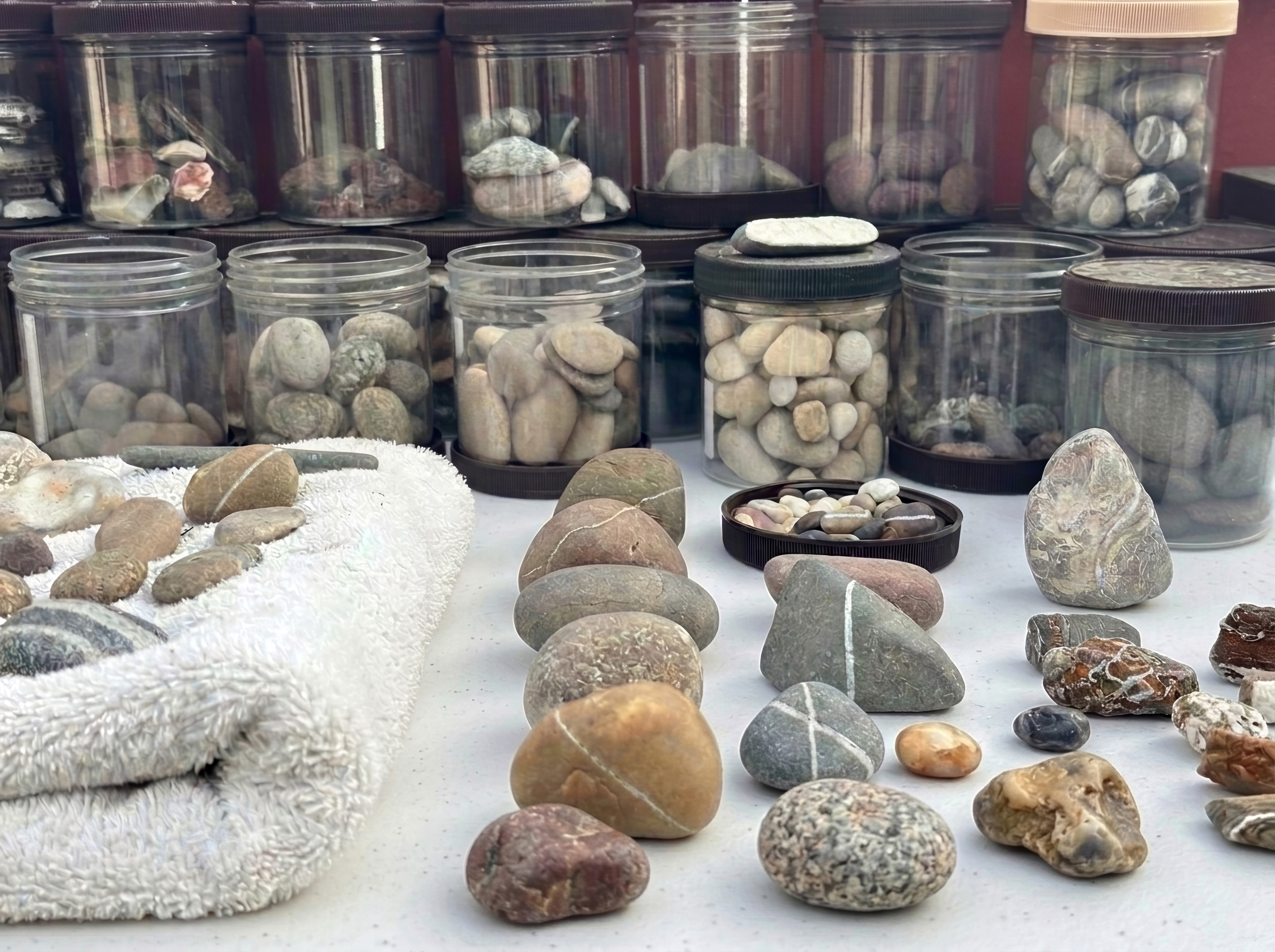 The Selection — stones sorted by type in jars and laid out for consideration